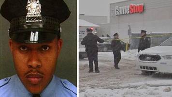 Philadelphia police mourn officer killed during robbery